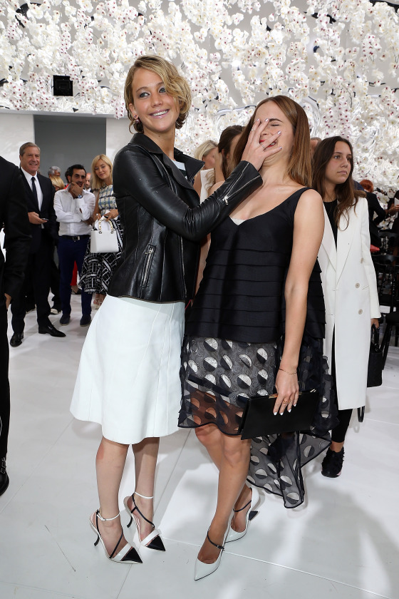 Jennifer Lawrence and Emma Watson at Paris Fashion Week. 