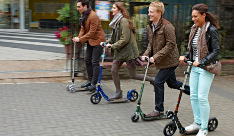adults on scooters
