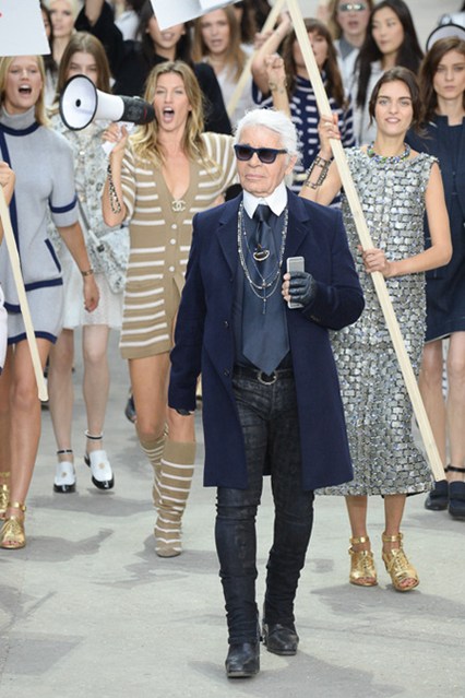 Karl Lagerfeld takes to the runway with his models.