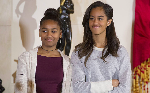 Obama daughters listen while the President speaks