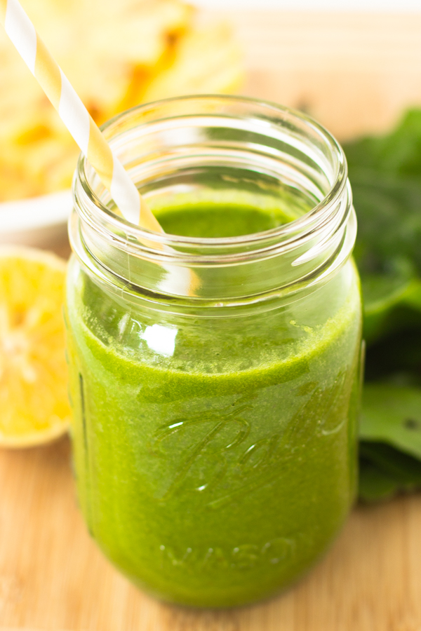 This-Tropical-Green-Smoothie-is-one-of-my-favorite-green-smoothies-loaded-with-spinach-pineapples-orange-juice-and-bananas.-Its-only-255-calories-and-deliciously-smooth-3