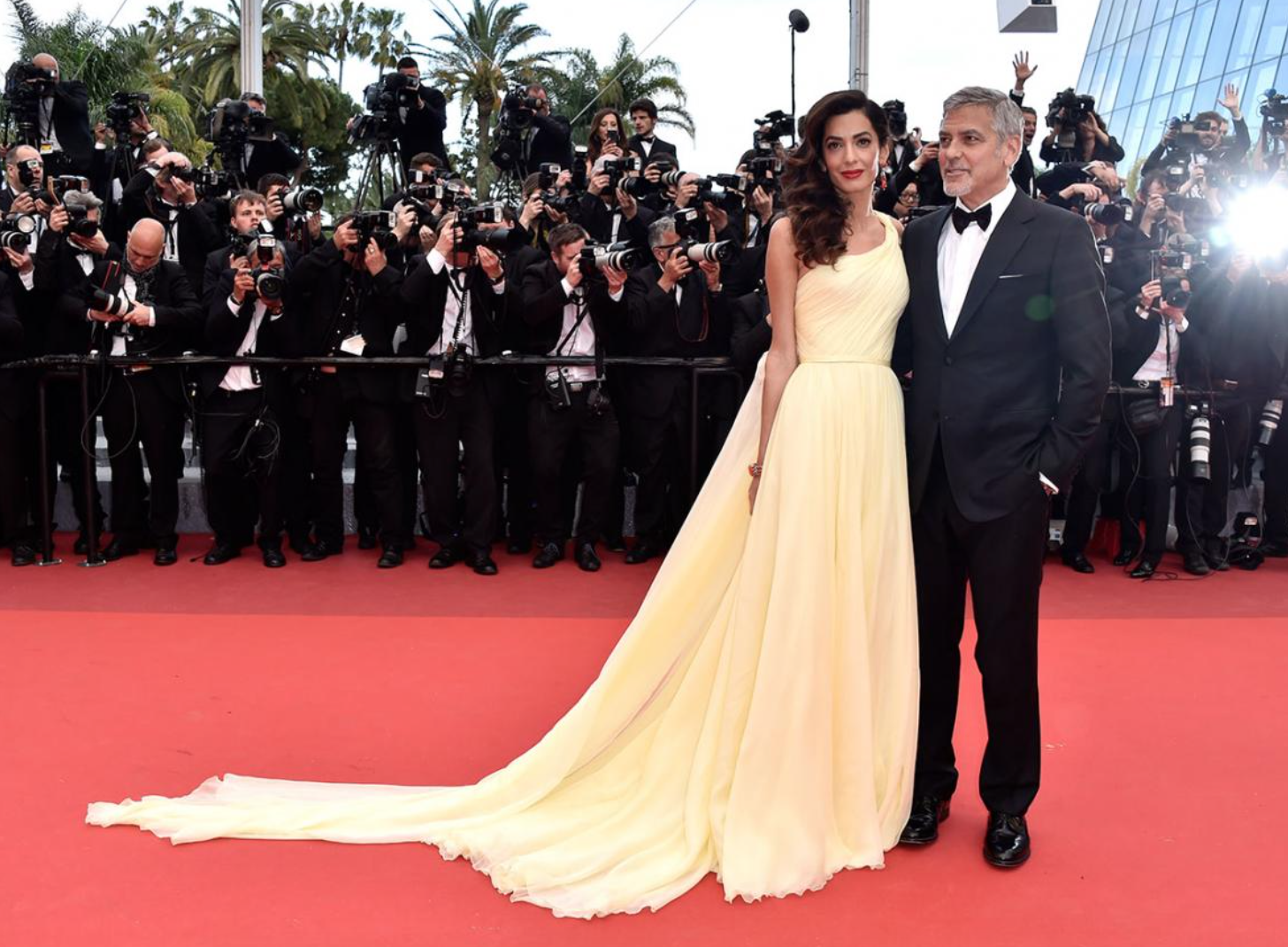 We're seeing yellow: Amal and her husband George Clooney step out onto the red carpet 